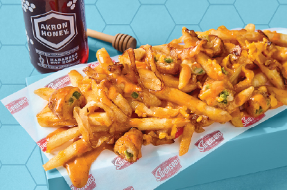 Hot honey loaded fries and honey bottle